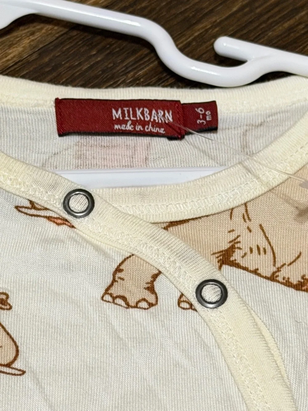 Milkbarn Cream Footed One-Piece with Peach Elephant Print